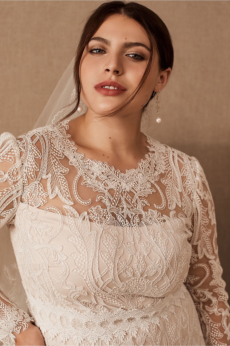 Chic short lace wedding dress with bell sleeves perfect for a sophisticated courthouse wedding