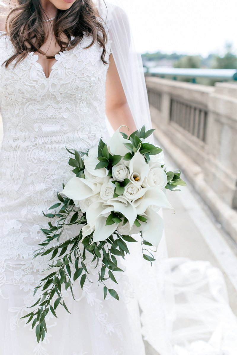 Classic and simple all white wedding bouquet for military bride with calla lilies and greenery