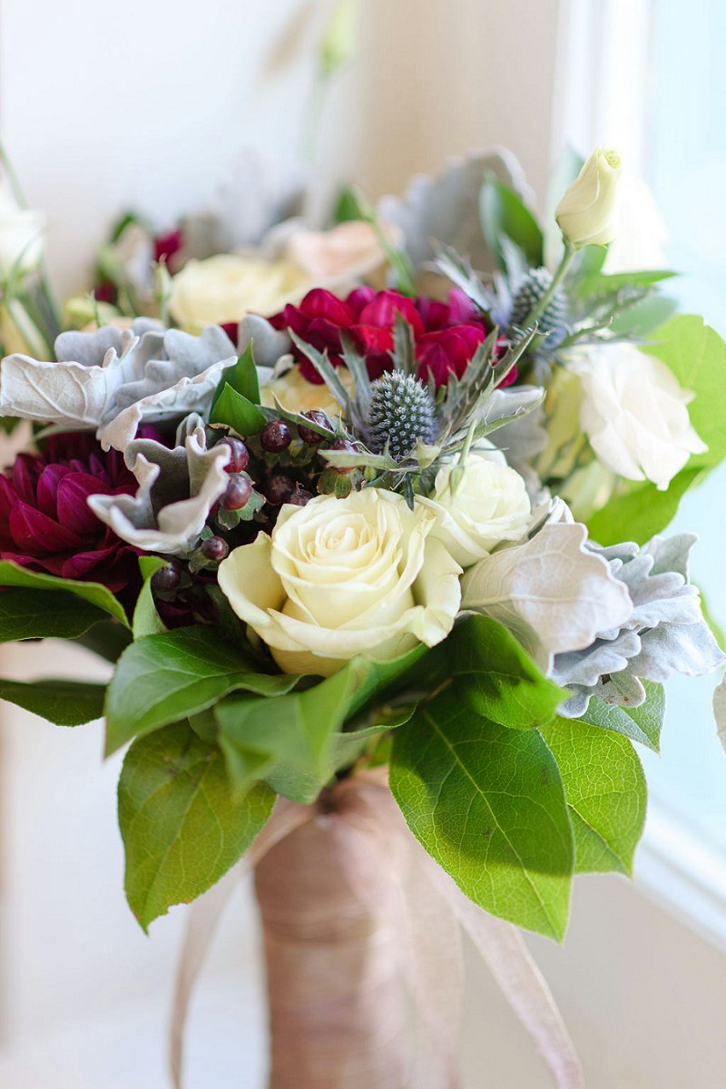 Winter bridal bouquet with blue thistle and dark magenta red dahlias for a chic wedding at the Historic Post Office in Hampton Virginia