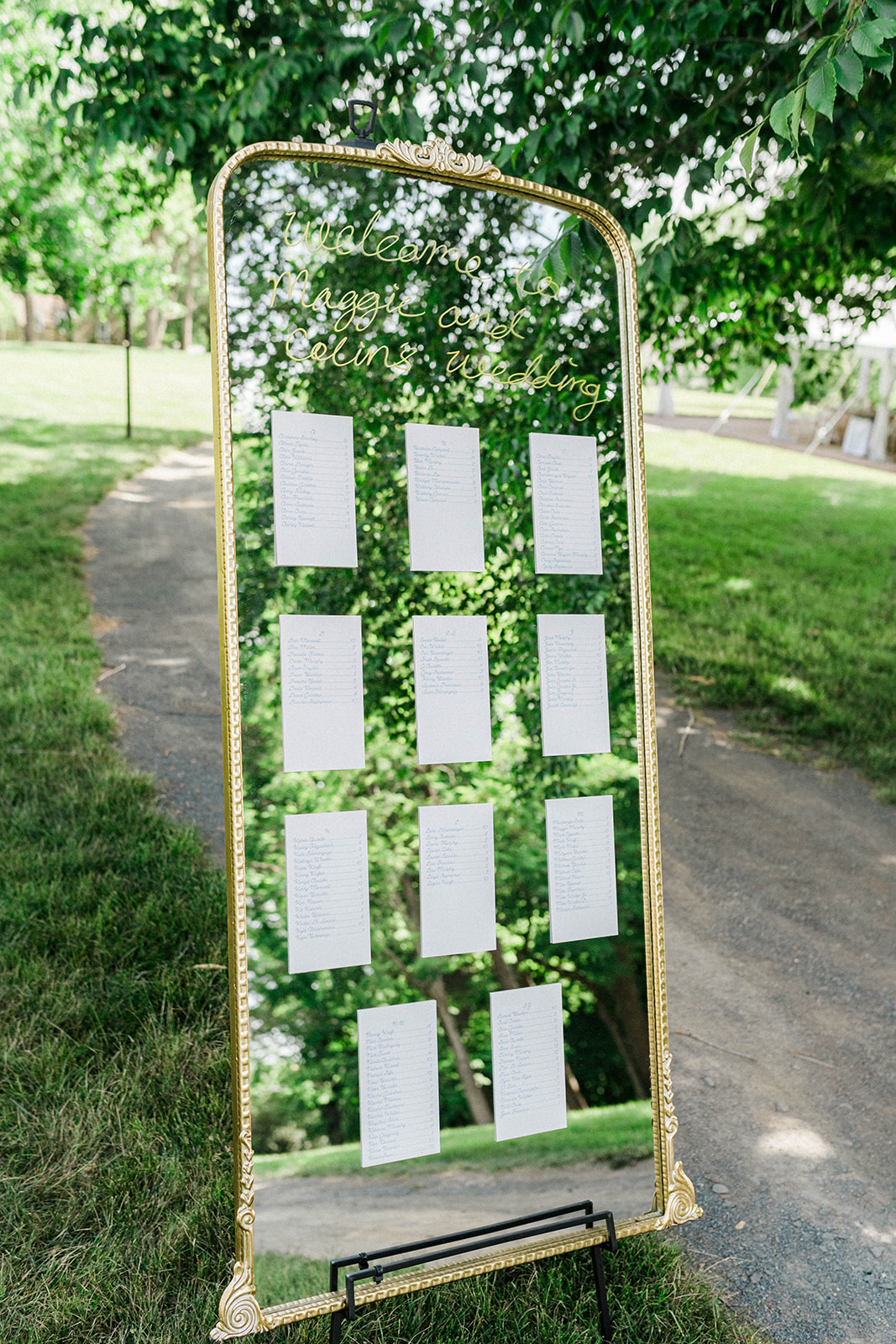 Large gold mirror wedding reception seating chart