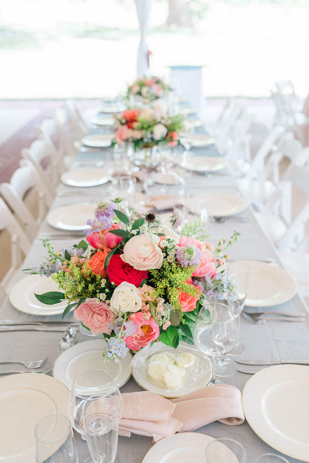 Bright and pastel mixed flowers for garden wedding centerpiece