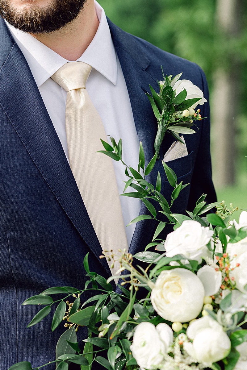 Classic white flowers for groom boutonniere and bridal bouquet for classic Virginia wedding at Saude Creek Vineyards