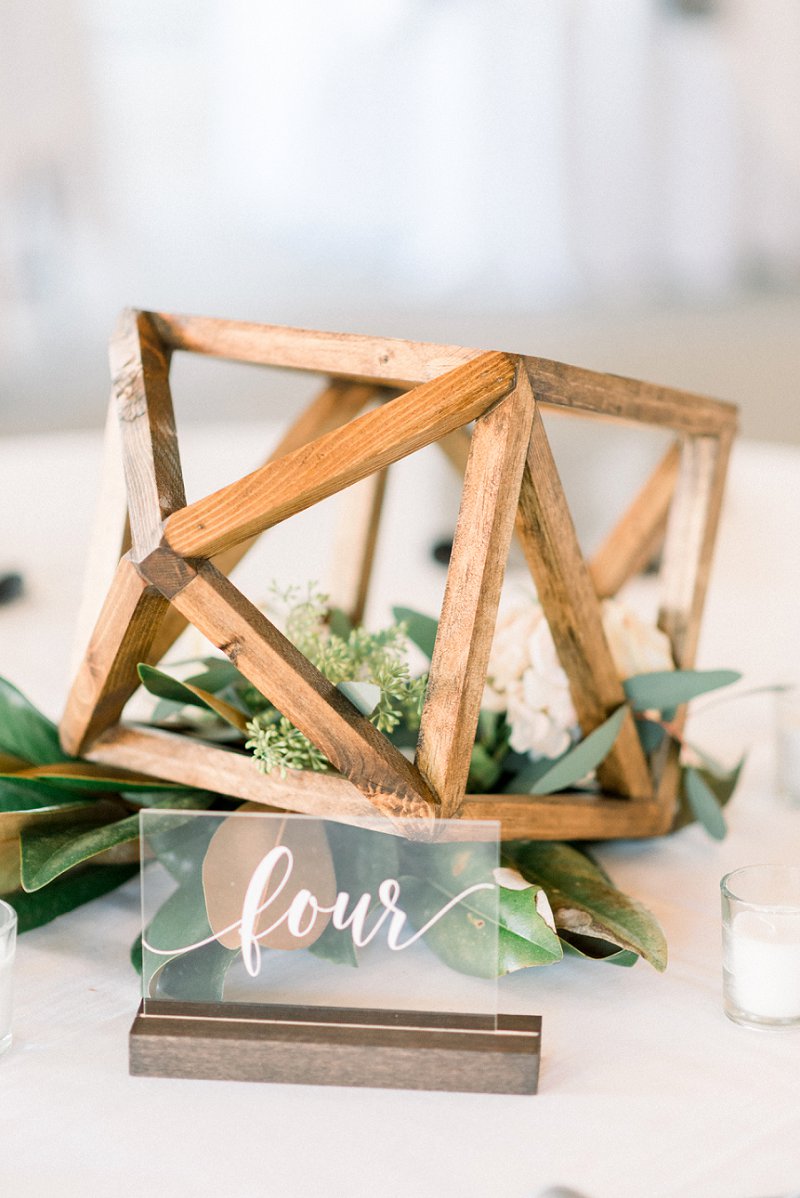 Wooden geometric wedding table centerpiece and clear acrylic table number for modern rustic wedding theme ideas