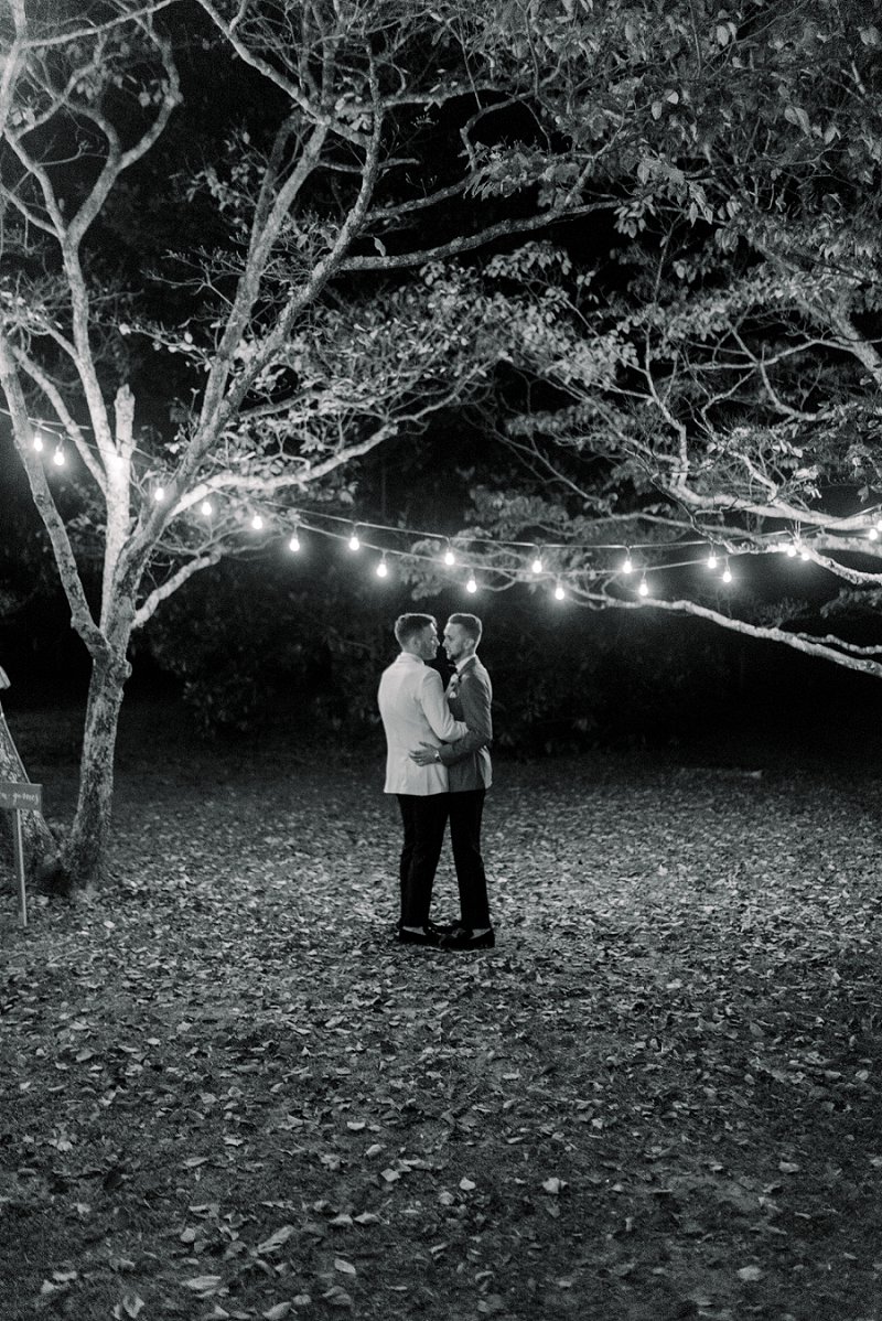 Two modern classic grooms sharing a last dance moment at Seven Springs in Richmond Virginia on Virginia Wedding Blog