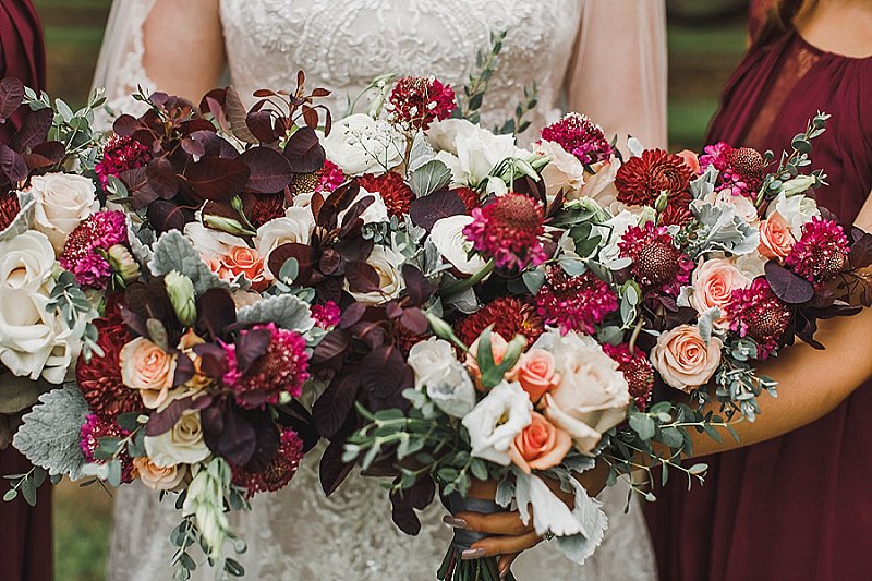 Gorgeous moody fall wedding bouquet with burgundy and white flowers