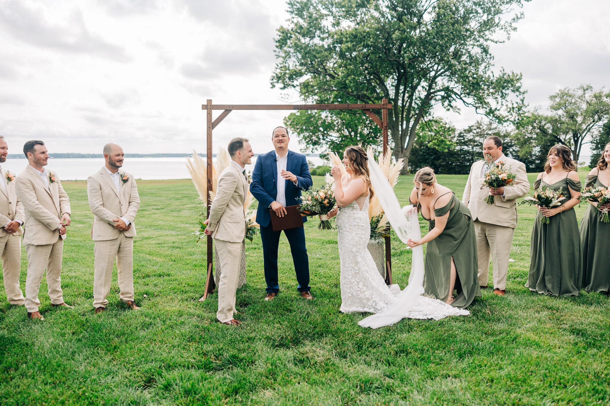 Outdoor wedding ceremony with pampas grass overlooking the Rappahannock River