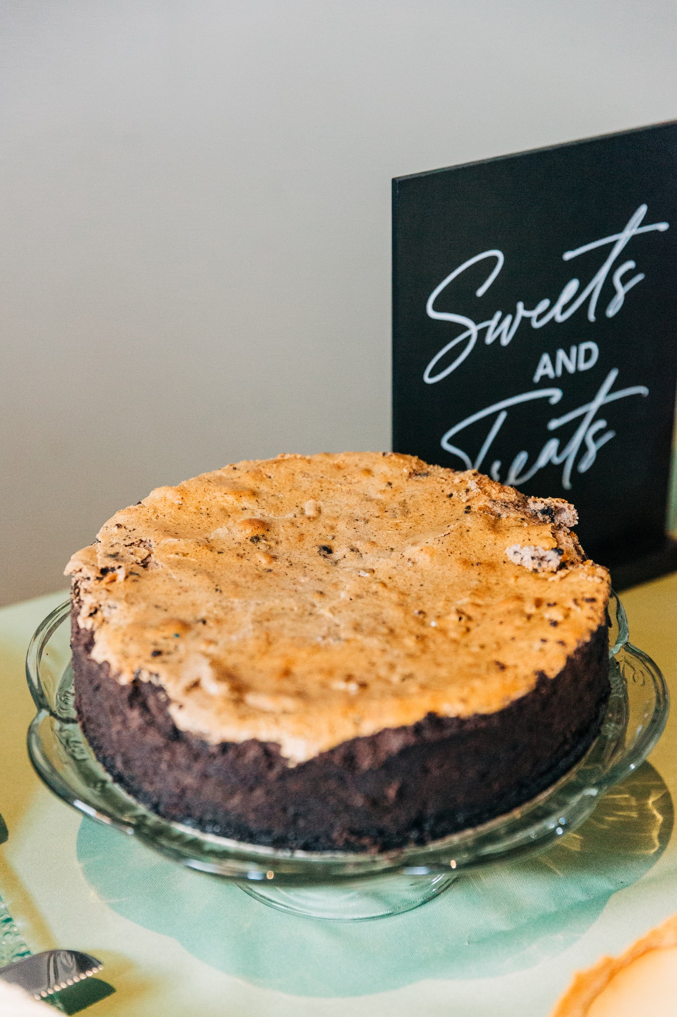 Chocolate peanut butter cake and desserts table at a rustic barn wedding in Virginia