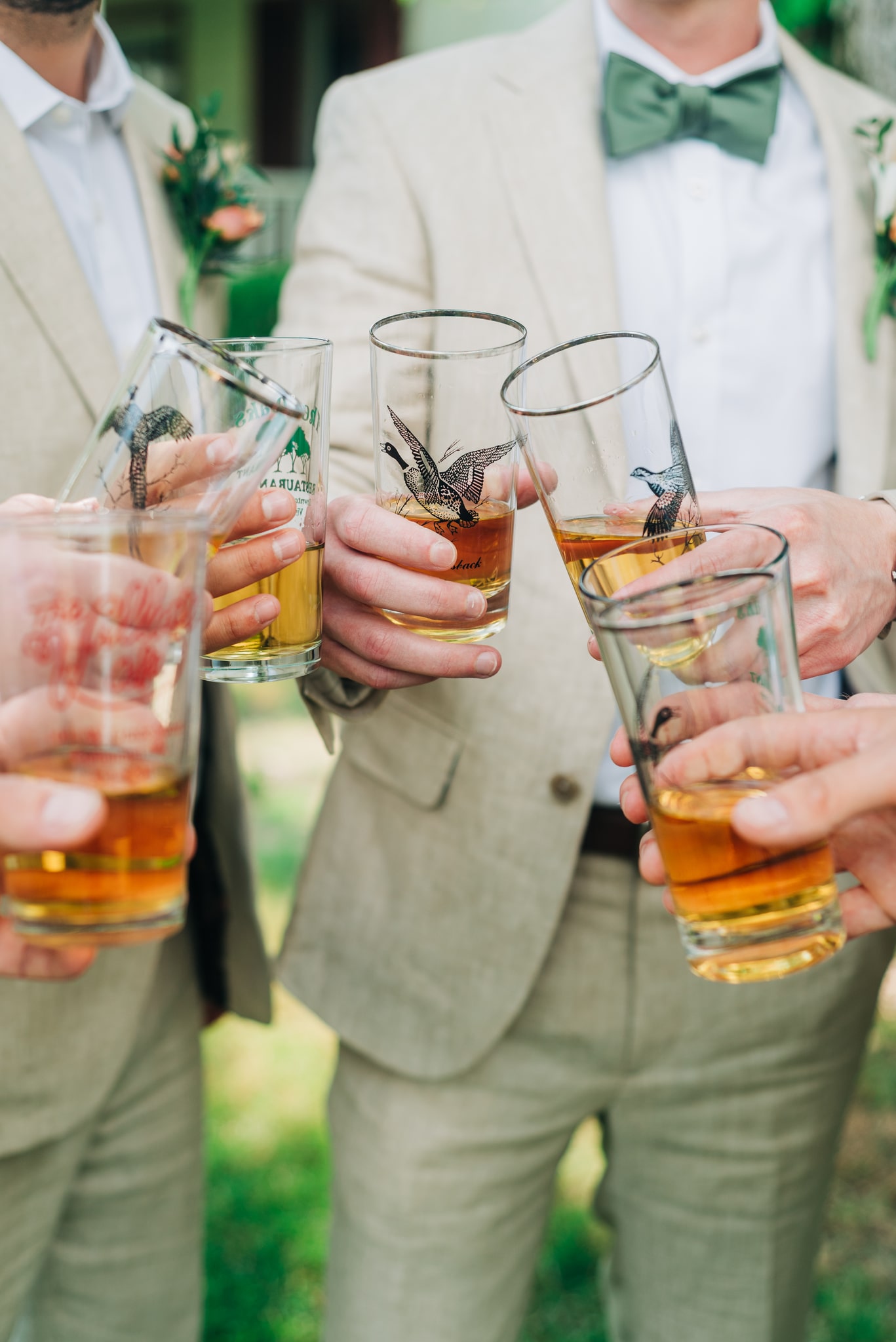 Rustic whiskey toast with groom and groomsmen on the wedding day