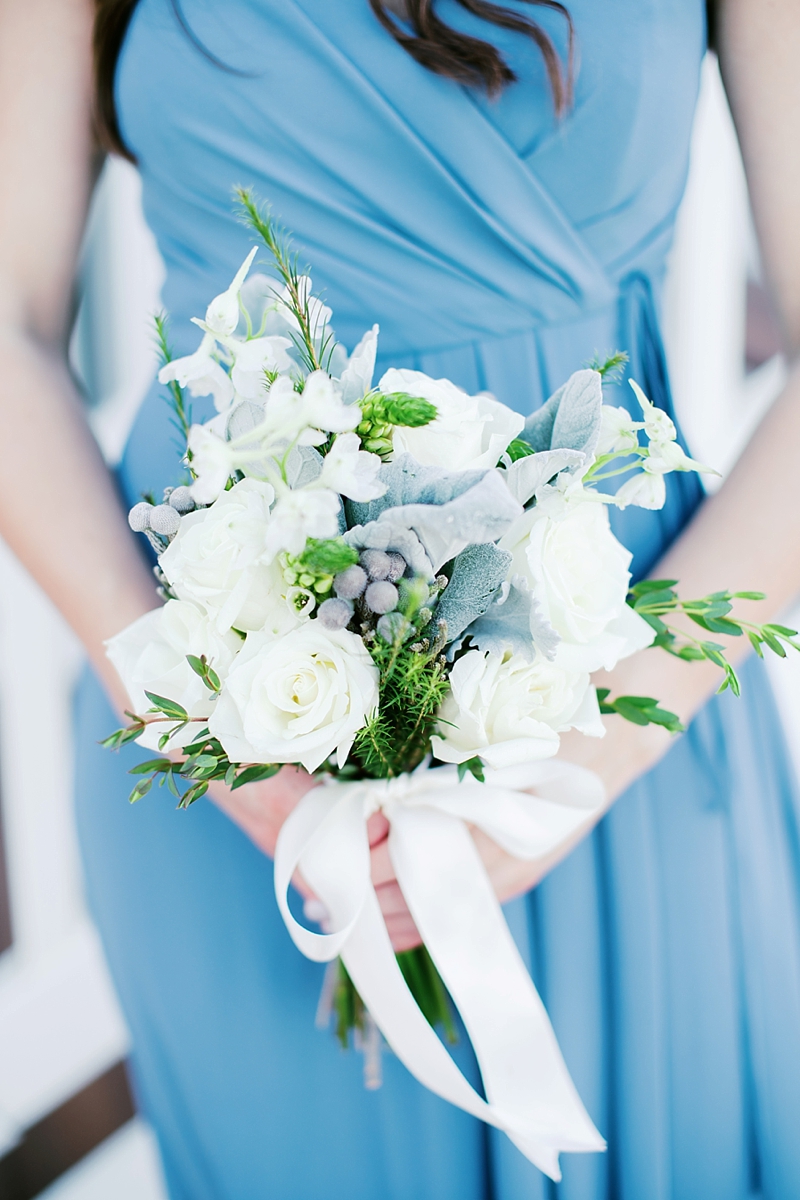 White and green bridesmaid bouquet with dusty miller for blue beach wedding