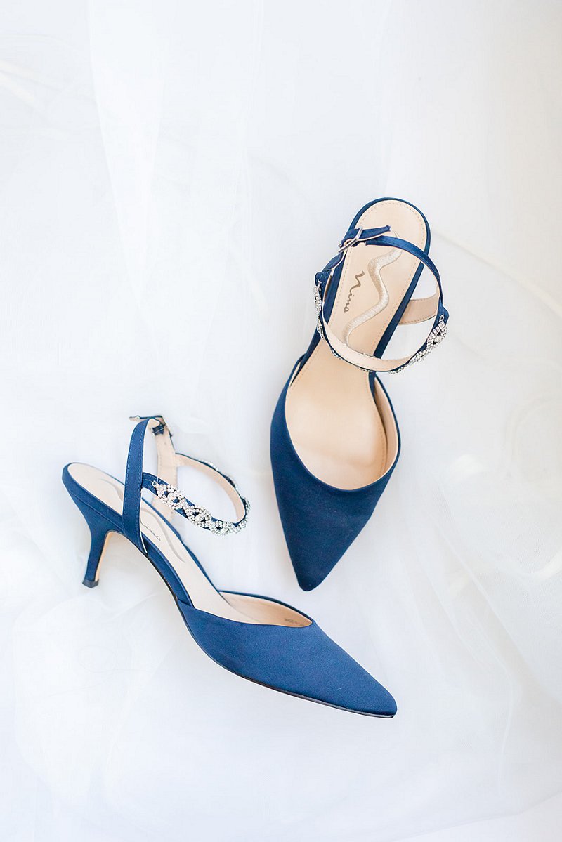 Pointed navy blue bridal shoes with bejeweled straps for Something Blue wedding idea